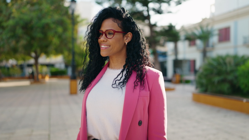 African american woman executive smiling confident standing at park