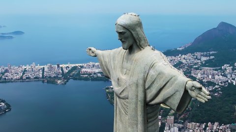 Rio de Janeiro, Rio de Janeiro, Brazil - 02.15.2022 - Panoramic view of Christ the Redeemer symbol of city of Rio de Janeiro Brazil. Cristo Redentor at Rio de Janeiro Brazil panning shot.