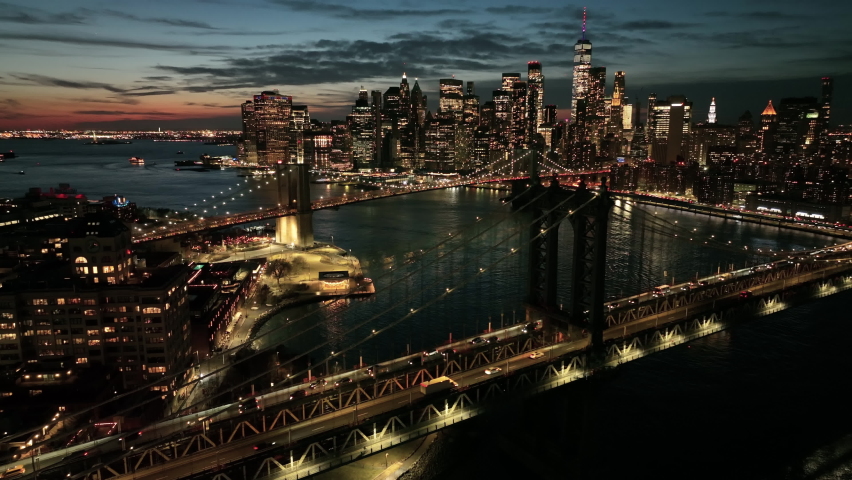 Alt dusk flying over Manhattan Bridge towards downtown NYC