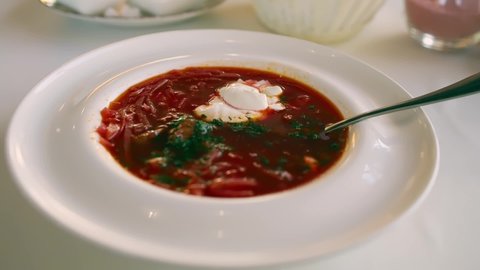 restaurant serving of Ukrainian borscht with sour cream