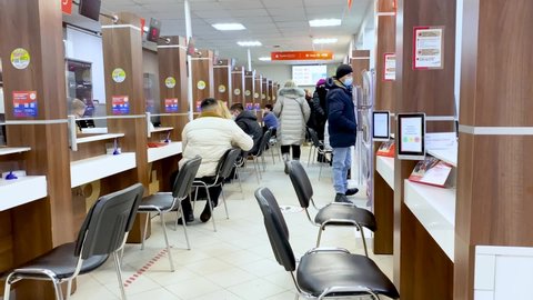 Moscow, Russia, December 2021: People in the Multifunctional Center for the provision of state and municipal services or "My documents"