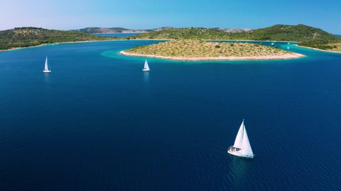 Yacht with white sails at sea. Yachting, luxury vacation at sea. Croatia.