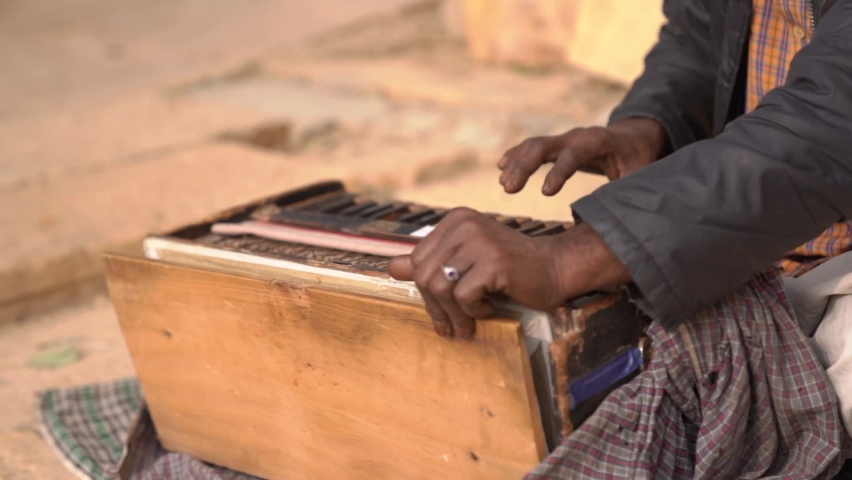 Harmonium Music Instrument of India, Hardworking Street Artist, old Rajasthani Men Playing harmonium, Stringed instrument. Royalty-Free Stock Footage #1087495421