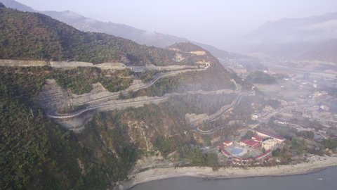 Aerial view of the BP Highway carved into the mountains from aerial view in Nepal.