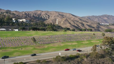 Aerial view of the flag-waving event on Sept. 11. Massive 9-11 tribute Waves of Flags along picturesque highway surrounded by beautiful hillsides as seen from above. Pepperdine Malibu, Los Angeles USA