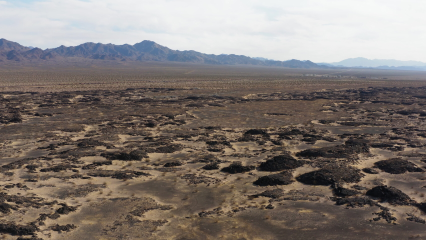 Aerial view of Mojave Desert of southern California, drone reveal remote natural mountains landscape of popular travel destination for trekking and exploring
