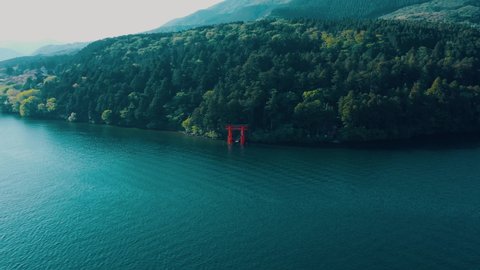 Beautiful 4K Drone shot of a Shrine with a beautiful river , trees and mountain view in the background 