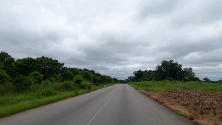 KENEMA, SIERRA LEONE - 16 OCT 2021: Sierra Leone Africa rural bush village drive POV. Third largest city in the country. West Africa extreme poverty. Transportation limited infrastructure.