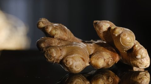 Whole ginger root on close up rotating.a composition based on ginger, fresh and spicy food that is good for the body, and an additional taste to food or drink. Concept: health, diet, health, nutrition