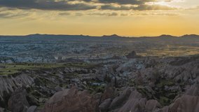 4k video time-lapse of amazing unusual landscape of turkish scenic Cappadocia. Sunset over mountains of Turkiye (Turkey) country. Amazing scenery of ancient canyons, plains, valleys and mountains