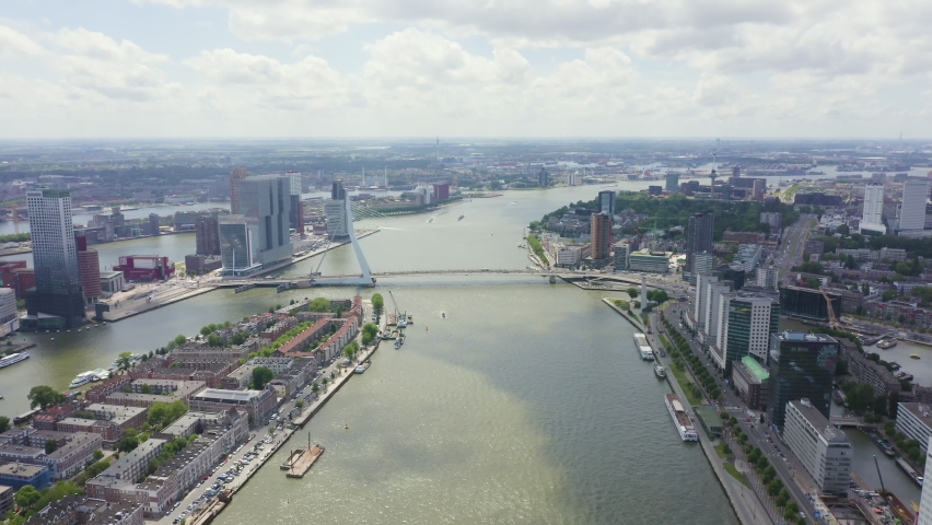 Inscription on video. Rotterdam, Netherlands. Norderayland Island ( North Island ) and Erasmus Bridge ( Erasmusbrug ) over the Nieuwe Maas River. Glitch effect text, Aerial View, Point of interest