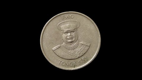 Rotating obverse of Tonga coin 10 seniti 1981. Isolated on black background.