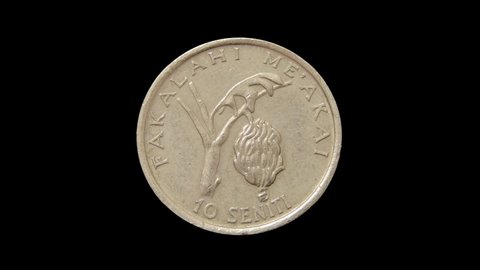 Rotating of Tonga coin 10 seniti minted from 1981 till 2005. Isolated on black background.