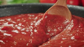 Stirring Tomato Sauce for Spaghetti or Pizza with Wooden Spoon - Zoom Out - Powered by Shutterstock - Get 15% off with code: PIKWIZARD15