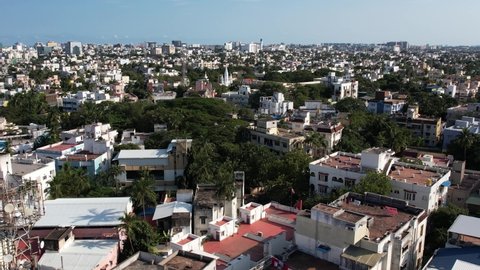 Aerial Drone Shot Of Building And Trees In The City Of Chennai. Chennai, on the Bay of Bengal in eastern India, is the capital of the state of Tamil Nadu.
