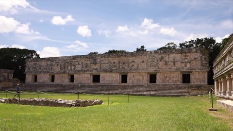 Tourist walking around of the ruins of the antique city of Uxmal.