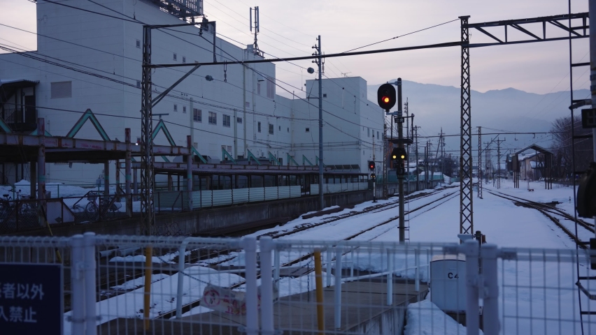 Snow Covered Train Line in the Countryside of Japan