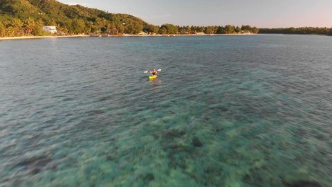 A girl is kayaking in paradise, Muri Lagoon, Rarotonga, Cook Islands