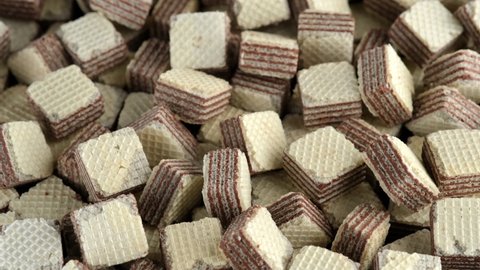 Square wafer biscuits close up, rotation. Dessert cocoa wafers. 4K UHD footage