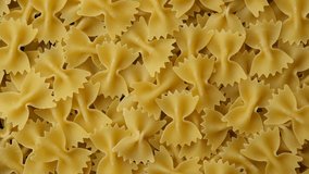 Pasta. Italian pasta farfalle top view, sliding shot