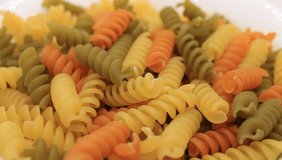 Macro video of colorful Italian pasta , shallow depth of field