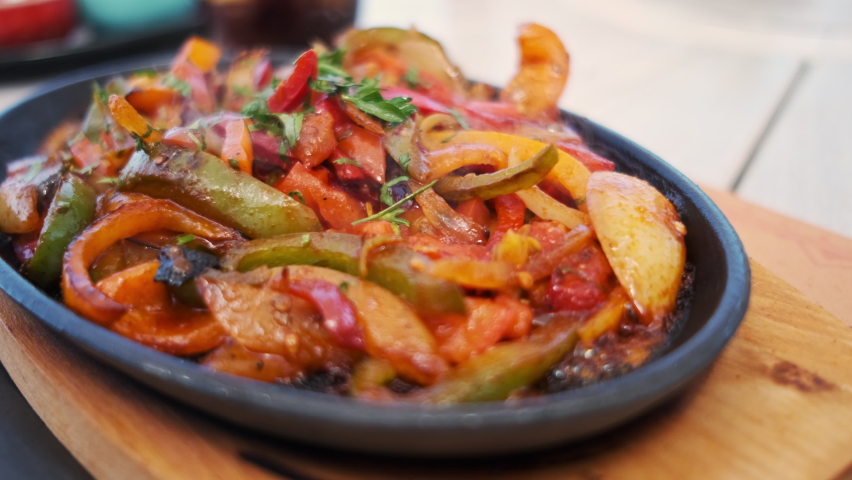 Hot mexican food in a pan. Mexican spicy cuisine in cafe. ugc  user generated content Royalty-Free Stock Footage #1087551089