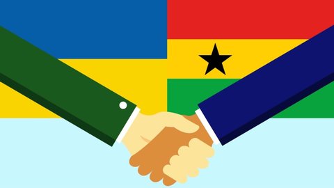 Handshake with two flags Ukraine and Ghana.