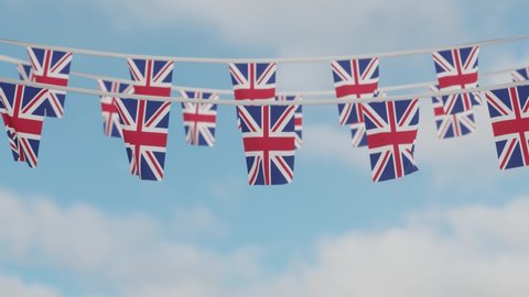 Union Jack (United Kingdom) flag bunting moving in the wind. 
