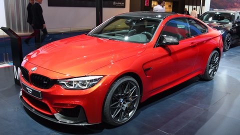 BRUSSELS, BELGIUM - JANUARY 10, 2018: BMW M4 coupe sports car on display during the 2018 European Motor Show Brussels. The M4 is the M Performance version of the BMW 4-series.
