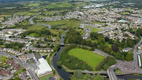 Aerial panoramic footage of residential boroughs with rows of houses on city outskirts. Ennis, Ireland