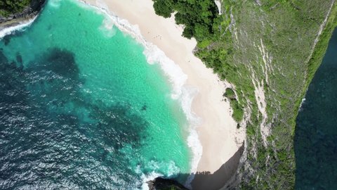 Aerial ocean waves and hills, Kelingking Beach Nusa Penida beautiful seascape in the world