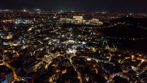 Athens Greece Aerial v1 hyperlapse drone flyover downtown towards acropolis on a rocky outcrop, capturing istorical significance and beautiful night cityscape - September 2021
