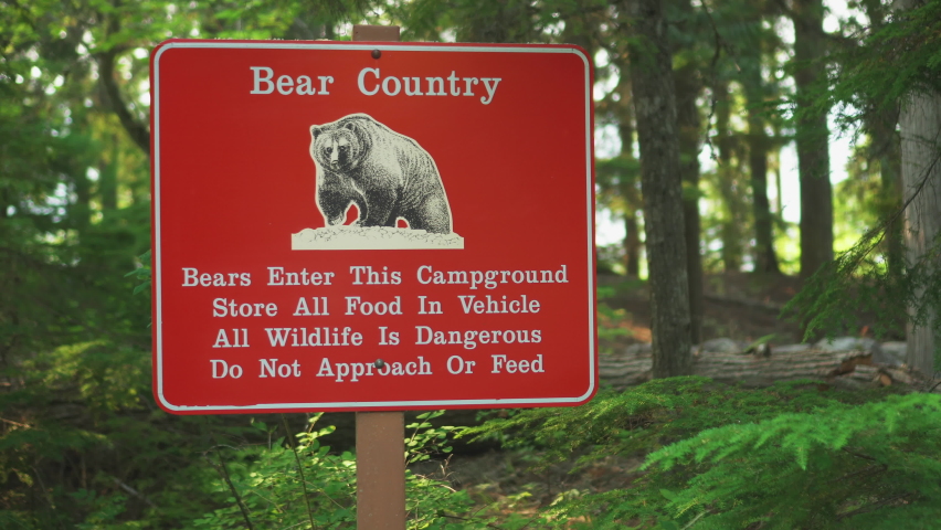 A Bear Country warning sign near a road inside Glacier National Park, Montana, U.S.A.Bear sightings in this area warning sign.