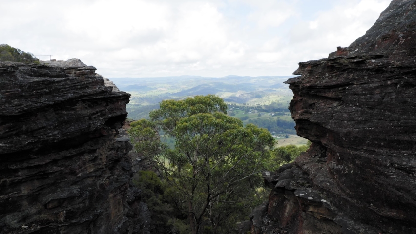 Drone aerial footage of a large valley and the nearby landscape near the town of Lithgow in the Central Tablelands area of New South Wales in Australia