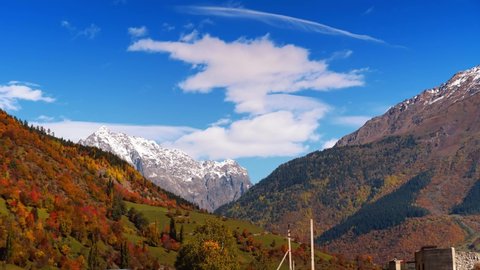 the time interval of clouds moving over the mountains in autumn. Beautiful landscape with mountain views in Georgia Svaneti.