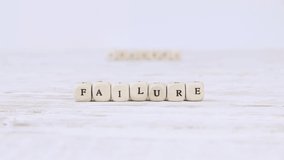 Wooden blocks with Failure sign going to Success. High quality 4k video.