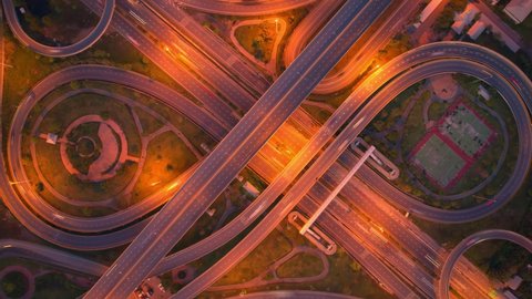 4K : Hyperlapse or Dronelapse Top view of Highway road junctions. The Intersection freeway road overpass the eastern outer ring road. Time lapse Aerial view 
