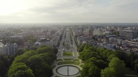 Inscription on video. Brussels, Belgium. Park of the Fiftieth Anniversary. Park Senkantoner. The Arc de Triomphe of Brussels (Brussels Gate). Text furry, Aerial View, Departure of the camera