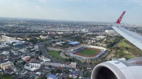 Bangkok, Thailand - January 2 2022: View out of the window of an aircraft landing at Bangkok Don Mueang International Airport