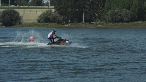 Irkutsk, Russia - August 3 2019: Baikal Jet Fest, BJF. Jet ski racing. Jet ski race in slow motion 180fps. Man riding jet skier on lake. Personal water craft PWC.