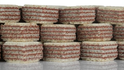 Square wafer biscuits isolated on white background. Cocoa wafers. 4K UHD footage.