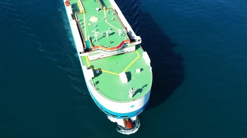 Aerial drone video of huge car carrier ship RO-RO (Roll on Roll off) cruising in Mediterranean deep blue Mediterranean sea