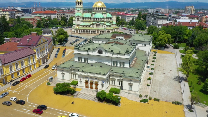 4K Aerial view of the capital of Bulgaria, Sofia. The iconic building of the world-famous Sofia. Bulgarian National Assembly. Flight over the Bulgarian Parliament. Roofs of buildings, streets, and parks in Sofia