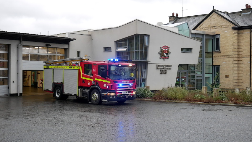 Norwich, Norfolk, United Kingdom. February 9, 2020. Norfolk Fire and Rescue Service. Scania fire engine turns out from Carrow Fire Station with blue lights flashing.
