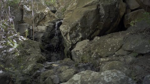 Mini little trickling waterfall slow motion in Gran Canaria, Las Palmas, Jardin Botanico Viera y Clavijo