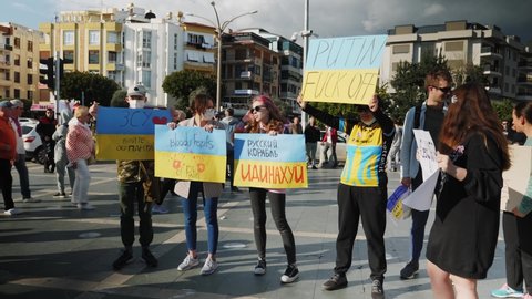 Demonstration and rally against Russia invasion of Ukraine. People standing to support Ukrainians in war with Russia. Ukrainian citizens protesting against Russia attacks: Alanya, Turkey - 26.02.2022