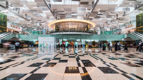 Singapore, Singapore - Feb 5, 2020: Time-lapse of Asian people or tourist traveler enter departure gate at Changi International Airport. Asia air transportation, or travel abroad lifestyle concept