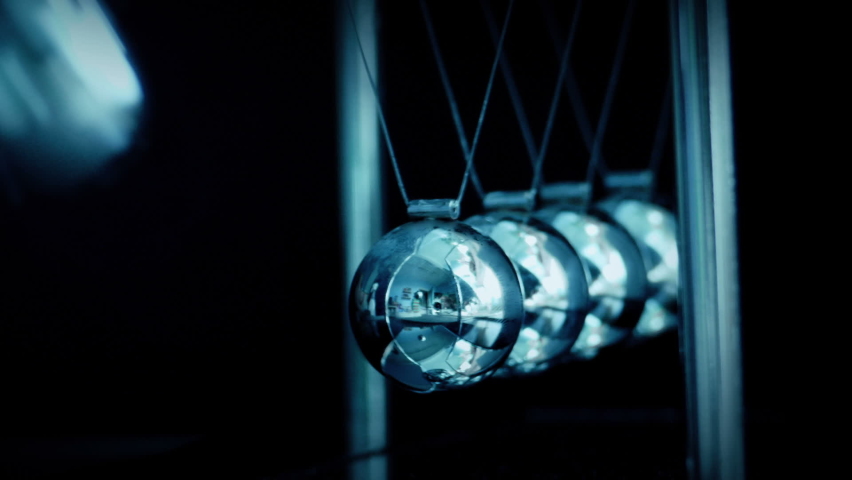 Metal Balls Hitting Corporate Toy - Looped Shot