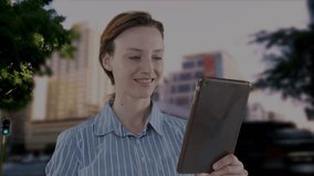 Animation of caucasian businesswoman using tablet and network of connections over cityscape. global business, connections, digital interface and technology concept digitally generated video.