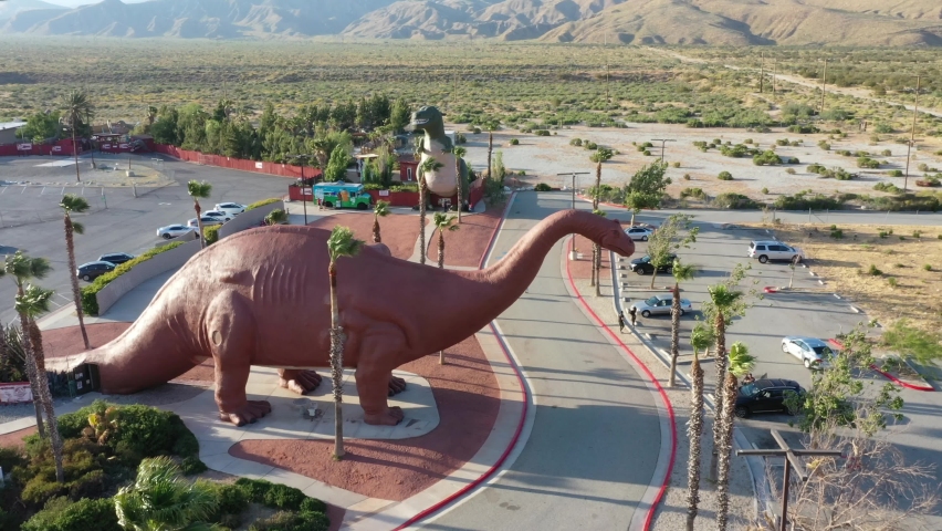 Two Enormous Dinosaurs At Cabazon Dinosaurs Near Palm Springs In California, USA. - aerial
